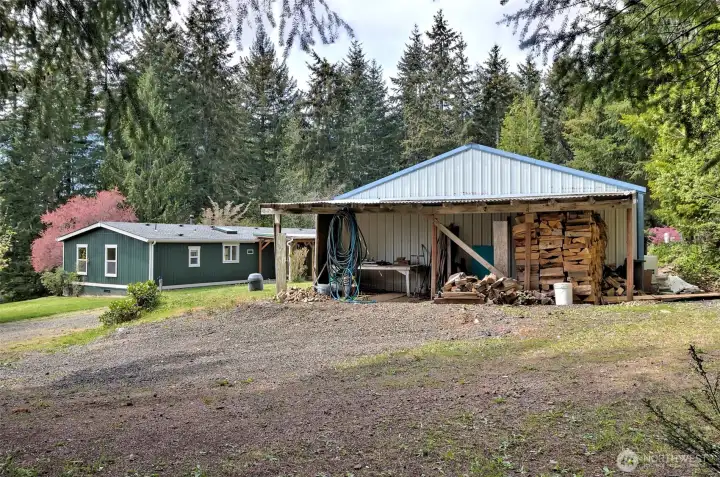 Large shop, with great covered area for wood storage.