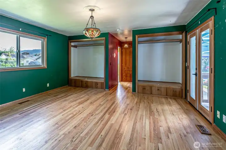 Primary Bedroom with two built in closets, and built in drawers.