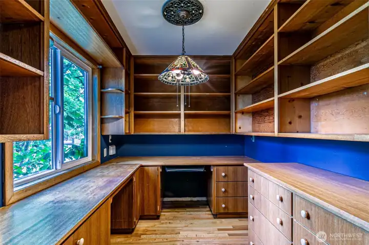 Separate office with built in desk, bookshelves, and filing drawers.