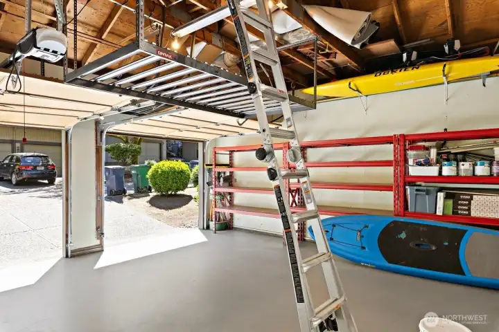 Vaulted ceiling in garage with extra rack and loft storage. Vaulted ceiling in garage with extra rack and loft storage.