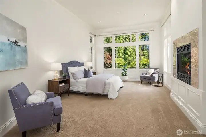 Main floor primary bedroom w/ fireplace