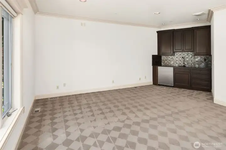 Wet bar in bonus/media room