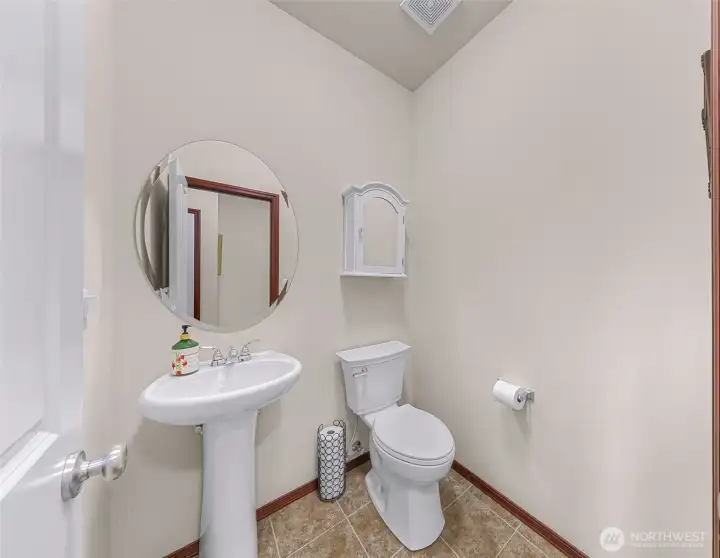 Main level 1/2 bath located just past the kitchen Main level 1/2 bath located just past the kitchen