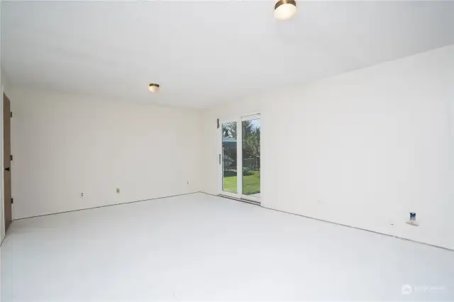 Great room with laundry room and additional bathroom off to the left.