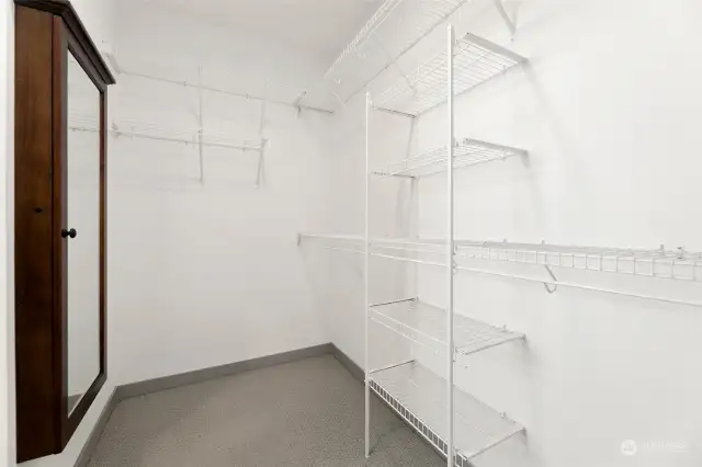 Say hello to your dream primary bedroom walk-in closet! With ample shelving, hanging space, and even a large mirror, this closet is ready to keep your wardrobe organized and your mornings stress-free.