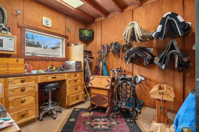 Heated tack room with built-in drawers and storage