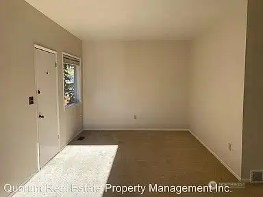 Front entry door and living room.