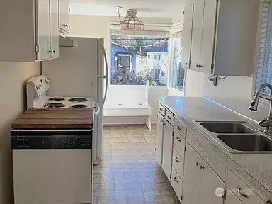 The eat-in kitchen is filled with light!