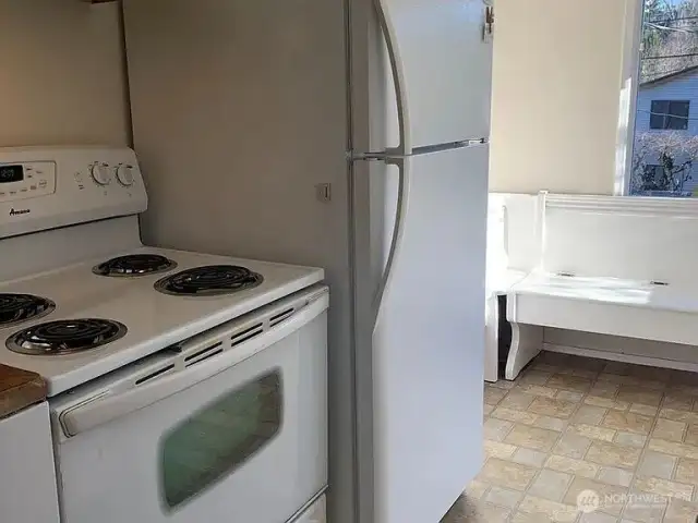 Kitchen looking into the eating-nook.