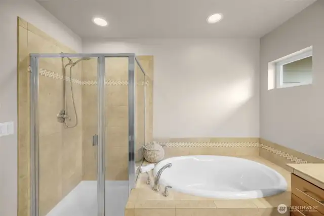 Primary bathroom has shower and tub