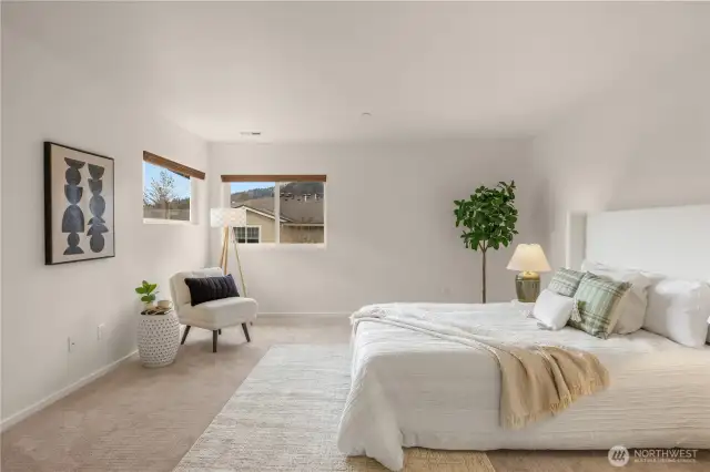 Spacious primary suite with mountain views
