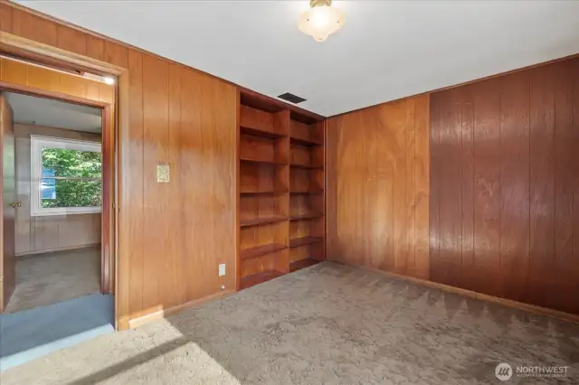 Beautiful built in shelving in front bedroom