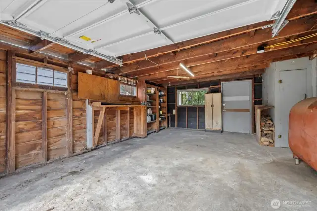 One car garage with multiple storage option and door to the covered patio