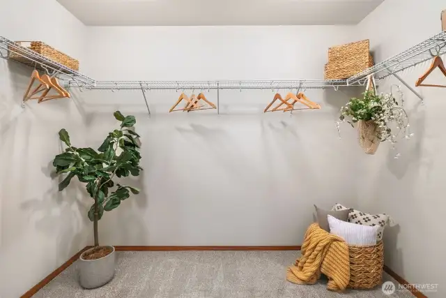 Primary bedroom walk-in closet