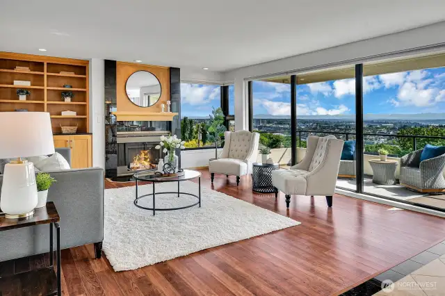 Built ins, fireplace, floor to ceiling windows