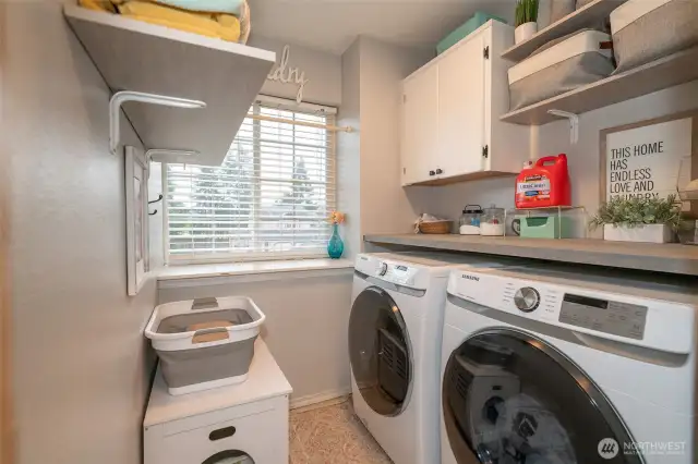 Laundry Room including a convenient shelf over the machines.