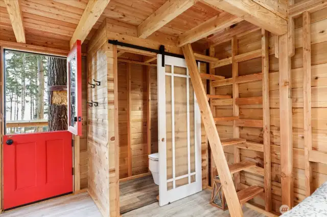 Composting toilet behind sliding barn door