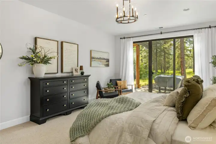 Primary bedroom with sliding glass to outdoor patio. Primary bedroom with sliding glass to outdoor patio.