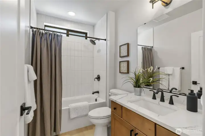 Guest bath adjacent to bedroom 2. Guest bath adjacent to bedroom 2.