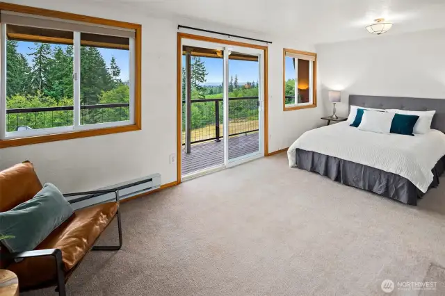 1 of 2 Primary Bedrooms. Has it's own private deck for a morning cup of coffee while the sun rises.