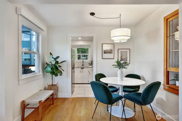 Dining room features original wood built-ins with leaded glass door.