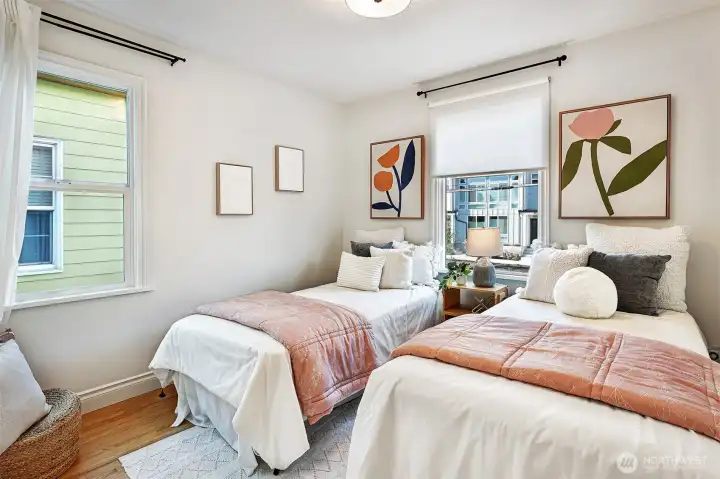 One of two bedrooms on the main level, with hardwood floors and cedar-lined closets.