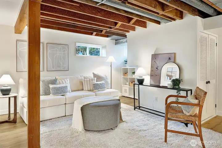Tall ceiling height and beautiful exposed wood in this multi-purpose space on the lower level.