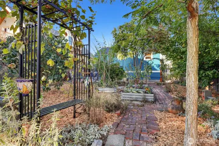 Follow the winding brick road throughout the peaceful private garden spaces.