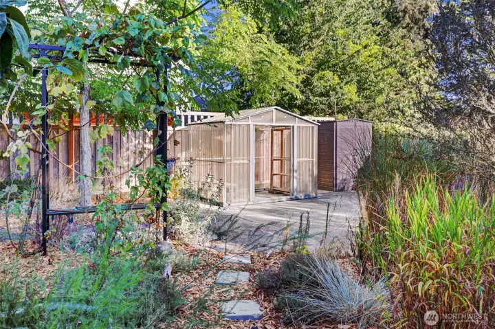 Charming greenhouse for garden starts or a playhouse.