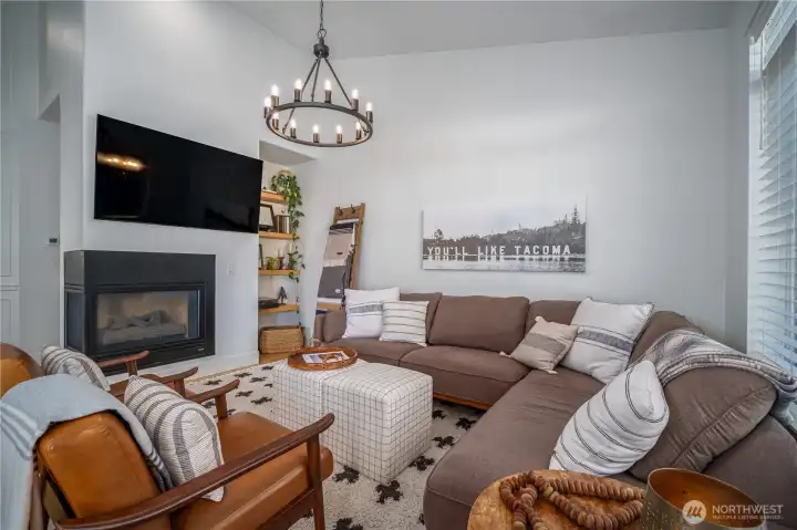 Imagine gathering around the inviting gas fireplace.