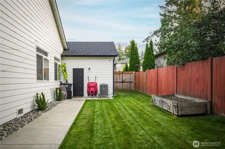 Backyard access to the spacious 3-car garage adds convenience.