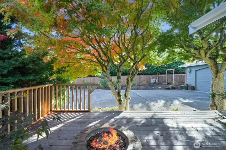 Front deck, fire-pit and level driveway