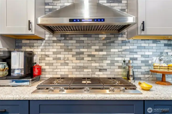 Lovely backsplash compliments the rest of the remodeled kitchen