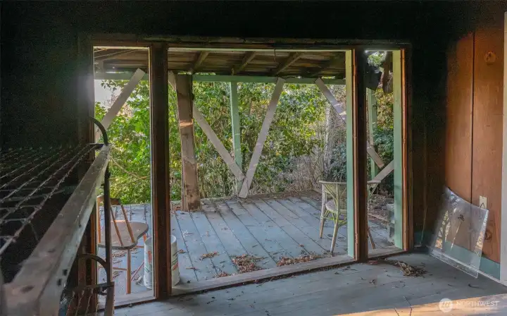 Living area of cabin to deck which is facing the view.