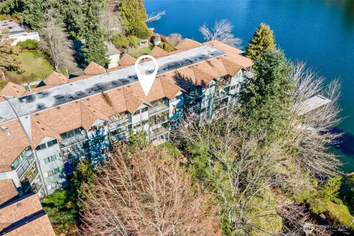 Rare Echo Lake waterfront living! This beautifully remodeled top-floor retreat sits far off the street for ultimate peace, offering incredible lake views from every room.
