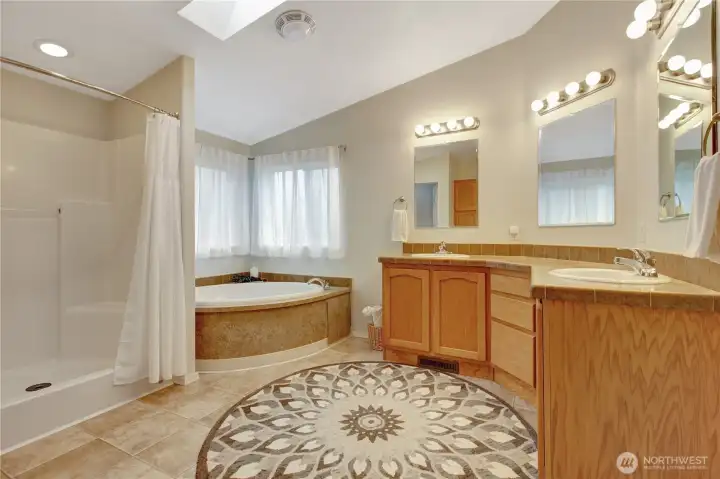 Fully equipped! Double sinks, bathtub, and stand up shower.