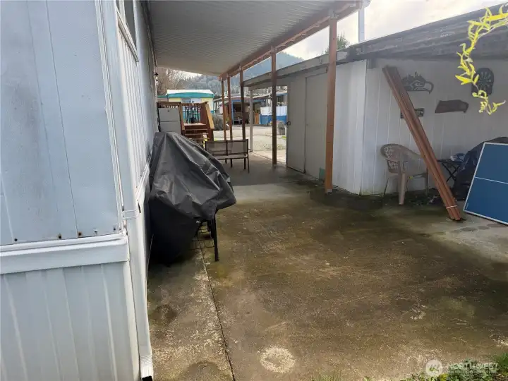 large front patio and covered storage area