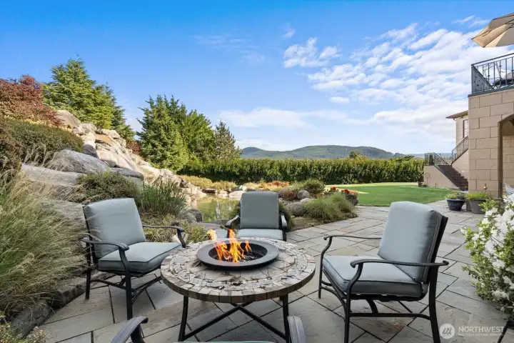 Patio overlooking stunning waterfall with pond
