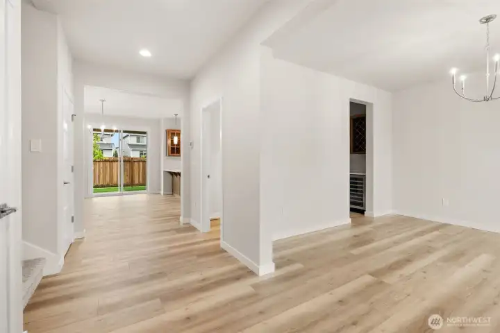 Hardwood flooring included in entry, kitchen, dining and nook area adding warmth and continuity throughout the hallway.