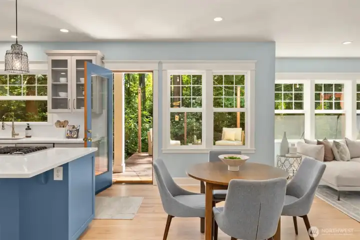 There are multiple doors leading to the back deck for easy access out to the outdoor spaces.