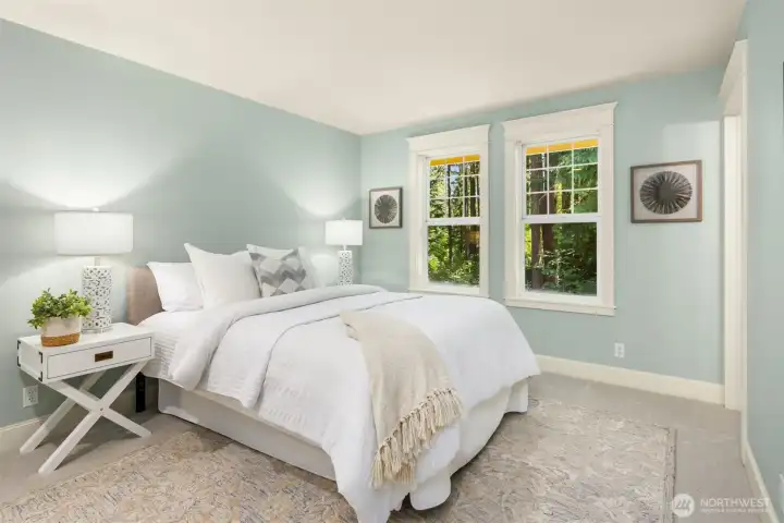 The second bedroom upstairs with its own private bathroom.