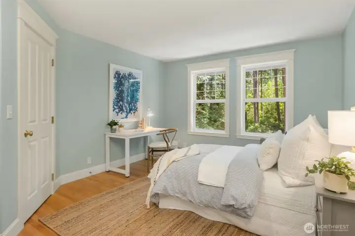 The third bedroom with hardwood flooring.