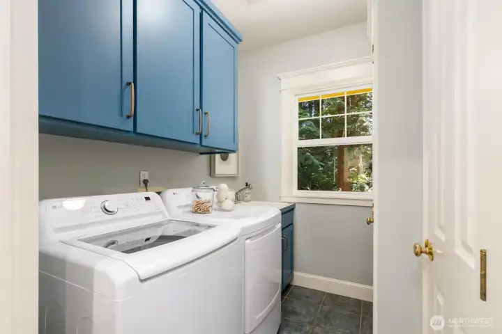 Back downstairs to the laundry room, which is just off of a handy mudroom space near the garage and covered breezeway.