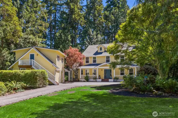 A broader look at the home and detached garage with Guest Studio.