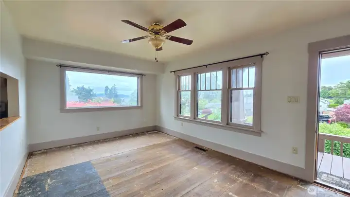 Living Room with Craftsman Window Casings & large triple-window assembly with multi-pane over single-pane design