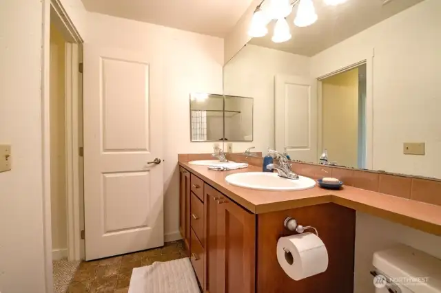Nice sized bathroom with dual sinks. Mirror has been replaced since pictures taken.
