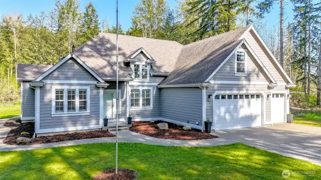 Super clean home with 3 car attached garage and a dream garage in rear of lot!