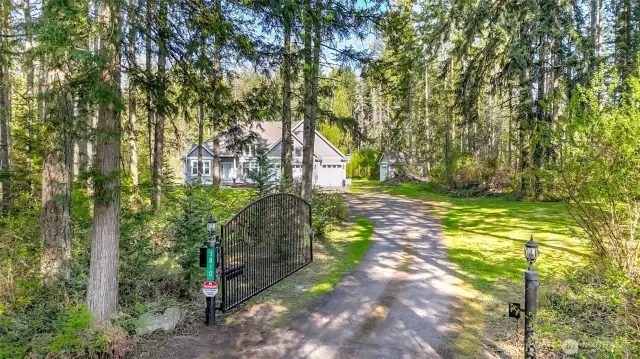 Gated driveway off Christansen Muck Rd leads to the house.  The second driveway to the north, leads to the 5,000 sq ft garage.