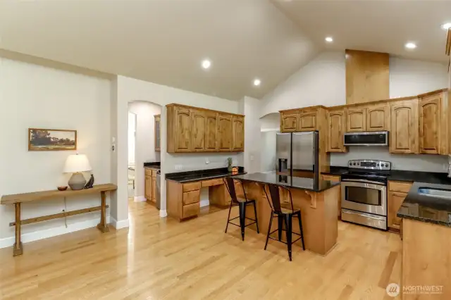 Another view of the kitchen with plenty of overhead lighting