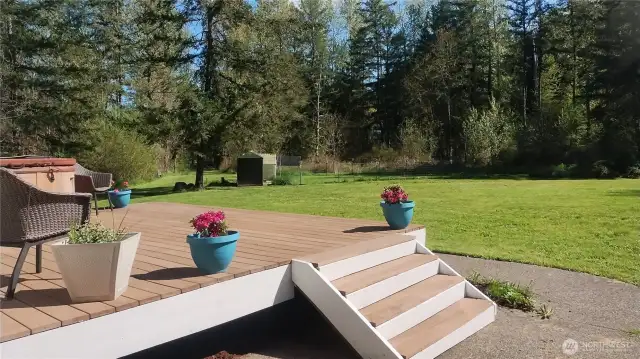 Deck off the primary bedroom with hot tub.    The north side of the property has a large fenced area for chickens.  The well head is located in this area as well